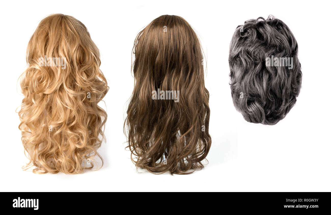 long curly blond ,black and brown hair wigs isolated on white background Stock Photo