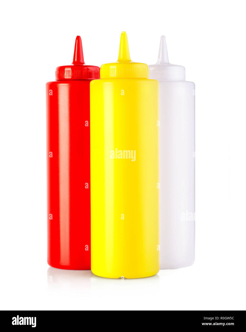 three plastic sauce bottles isolated on a white background Stock Photo