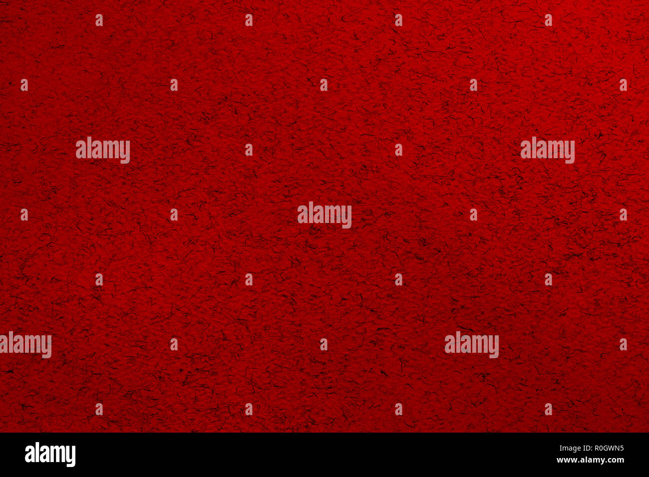 Trendy dark red abstract background with small black chaotically scattered lint Stock Photo