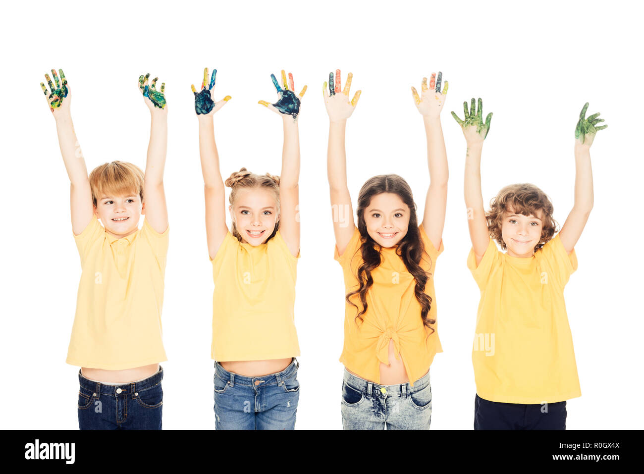 adorable happy kids showing hands in paint and smiling at camera ...