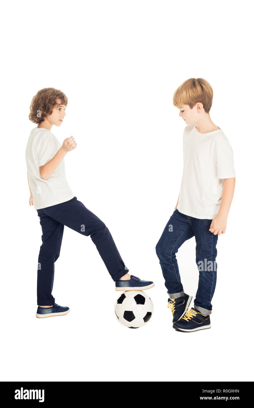 adorable boys playing with football ball isolated on white Stock Photo