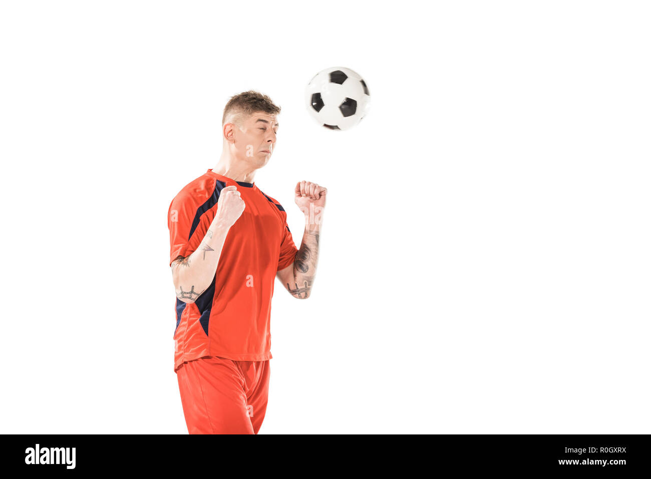 Football player hitting ball head Cut Out Stock Images & Pictures Alamy