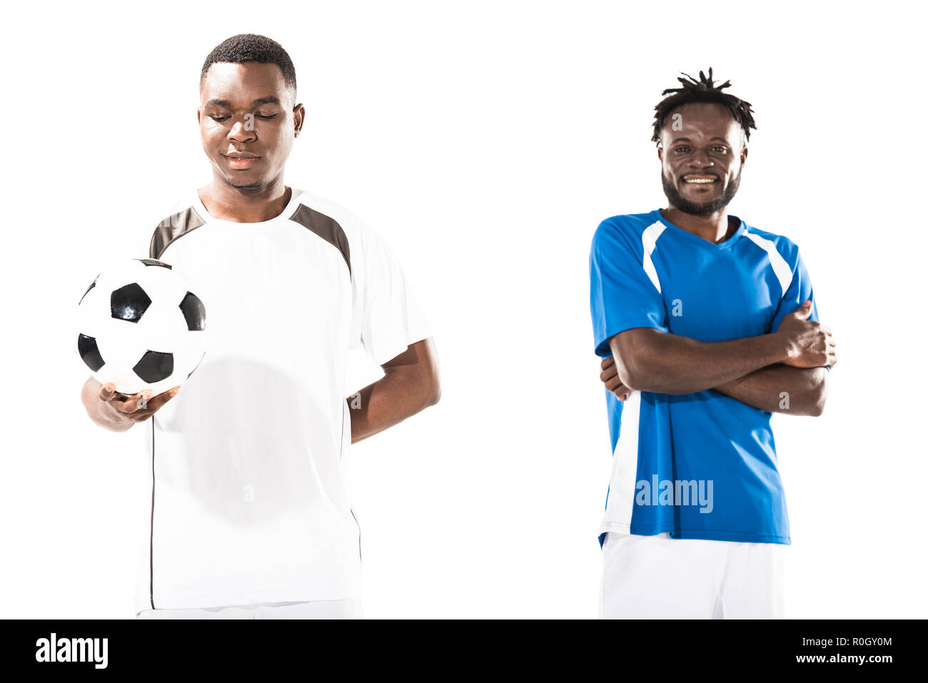 smiling athletic young african american soccer players standing