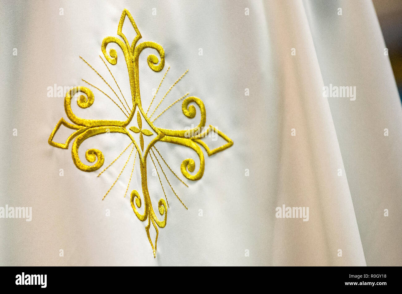 Embroidered cross on the back of a Catholic priest's vestments Stock Photo