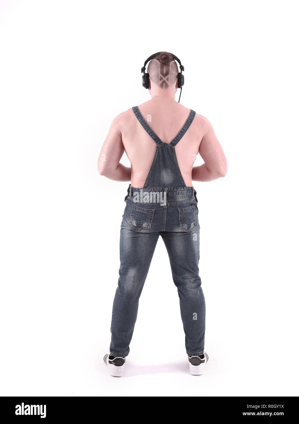rear view.stylish man in denim overalls. isolated on white Stock Photo -  Alamy