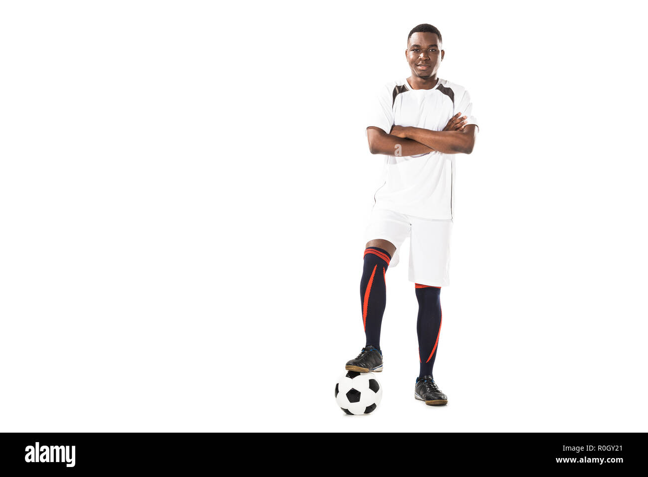 serious young woman in american football uniform looking at camera with  crossed arms isolated on white Stock Photo - Alamy