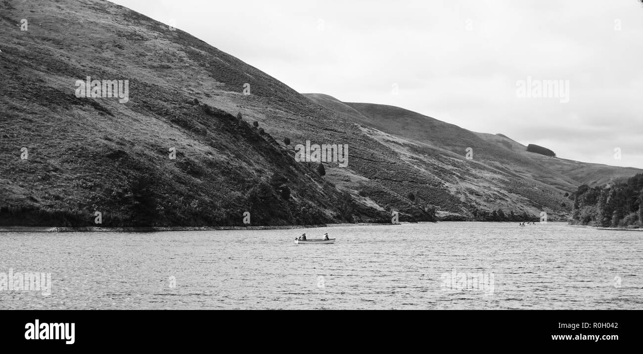 Two men fishing boat Black and White Stock Photos & Images - Alamy