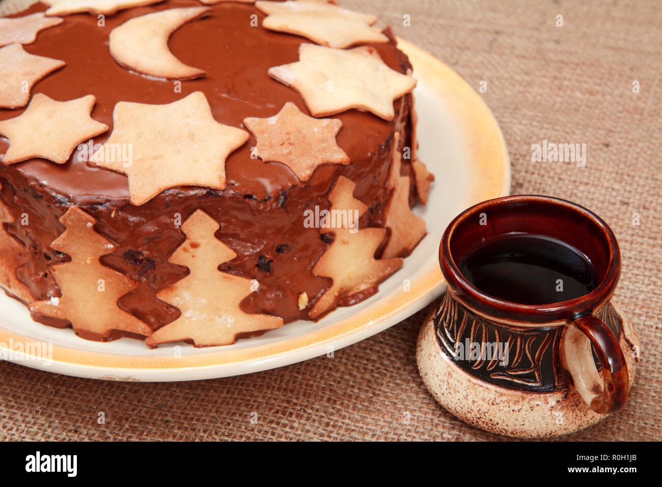 Homemade Chocolate Cake Decorated With Christmas Ornament And Cup Of