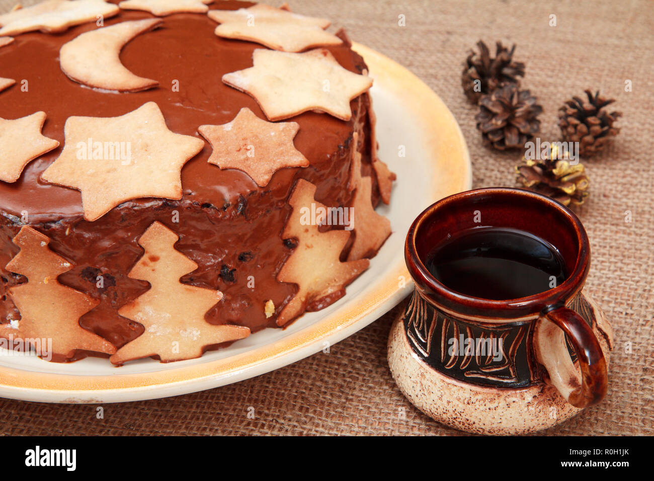 Homemade Chocolate Cake Decorated With Christmas Ornament And Cup