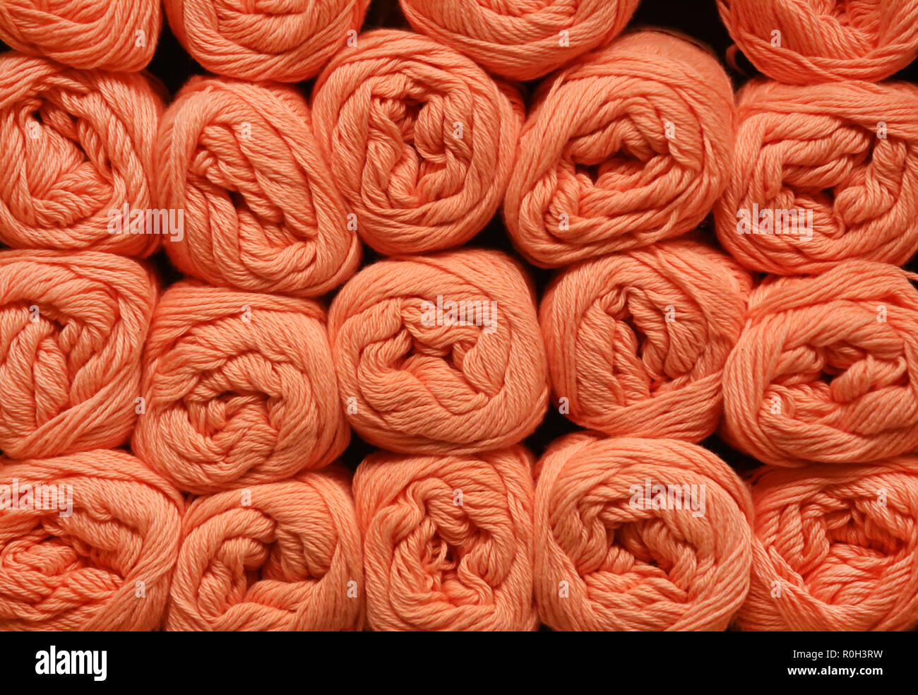 Wool rolls in a shelf as a background Stock Photo