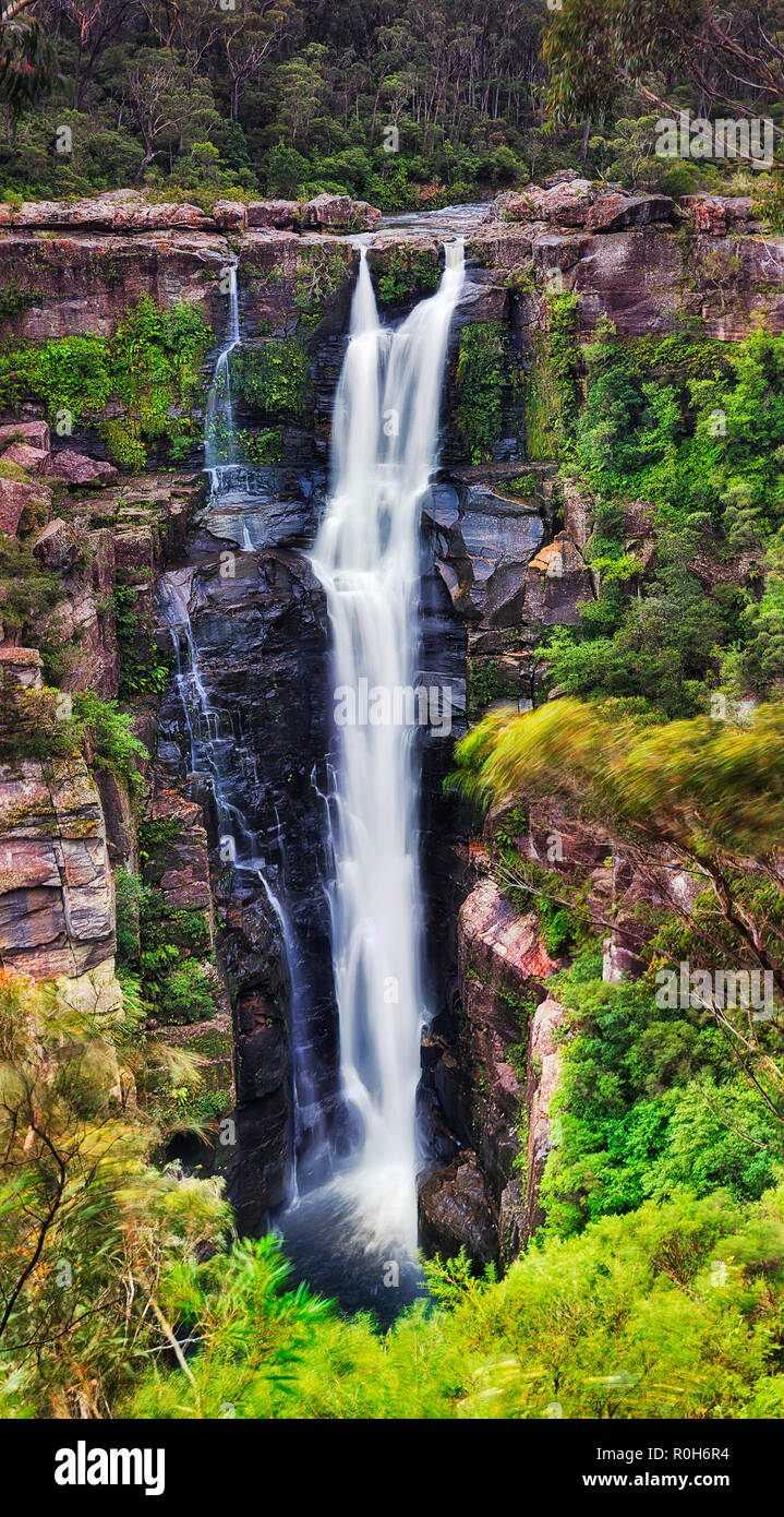 Full hight of tall Carrington waterfall in Morton national park of Australia in SOthern Highlands region of NSW. BLurred massive stream of fresh water Stock Photo