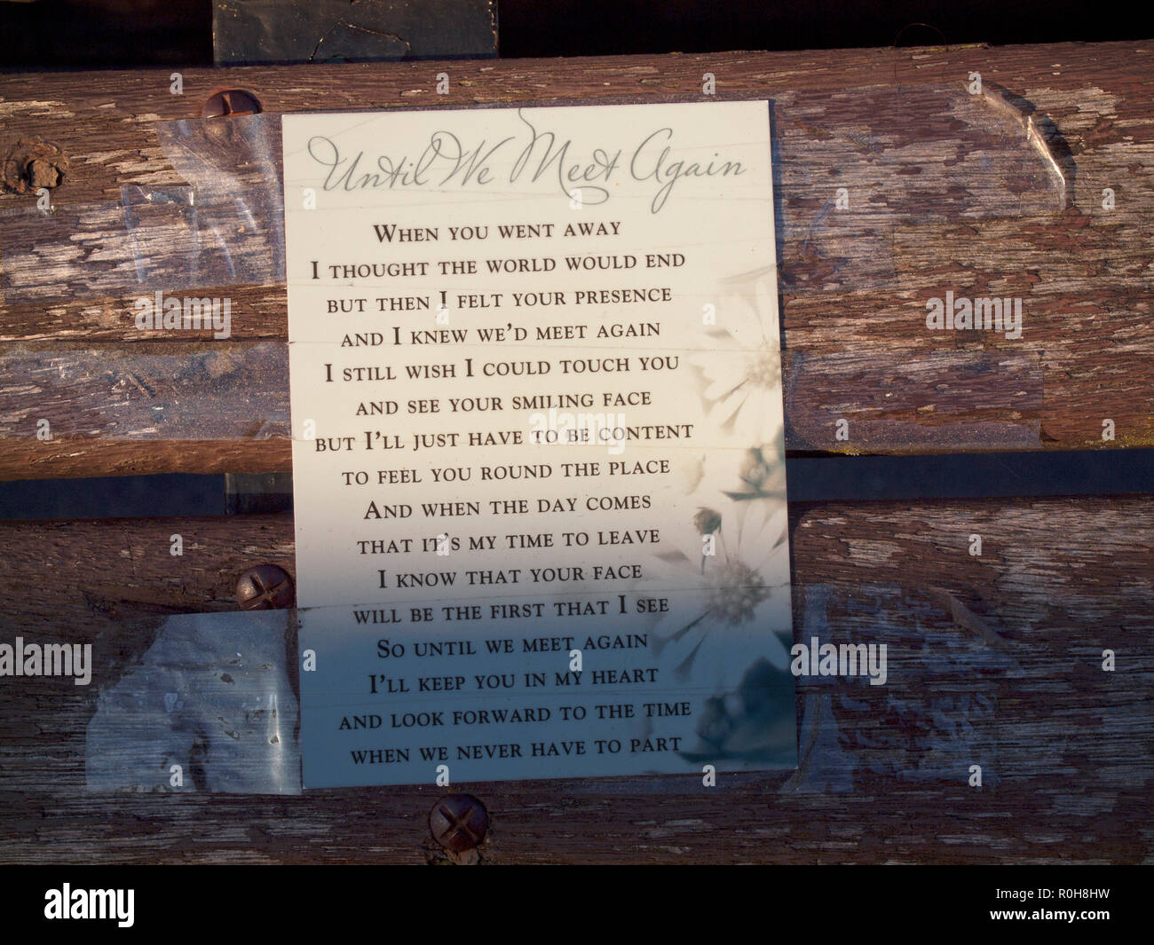 A message to someone who has died, stuck to a bench in a Brighton street Stock Photo