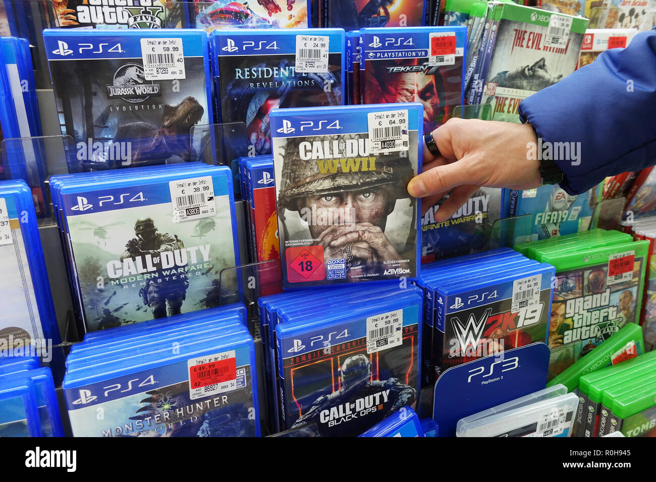 Store display filled with PlayStation 4 games for a home video game console Stock Photo