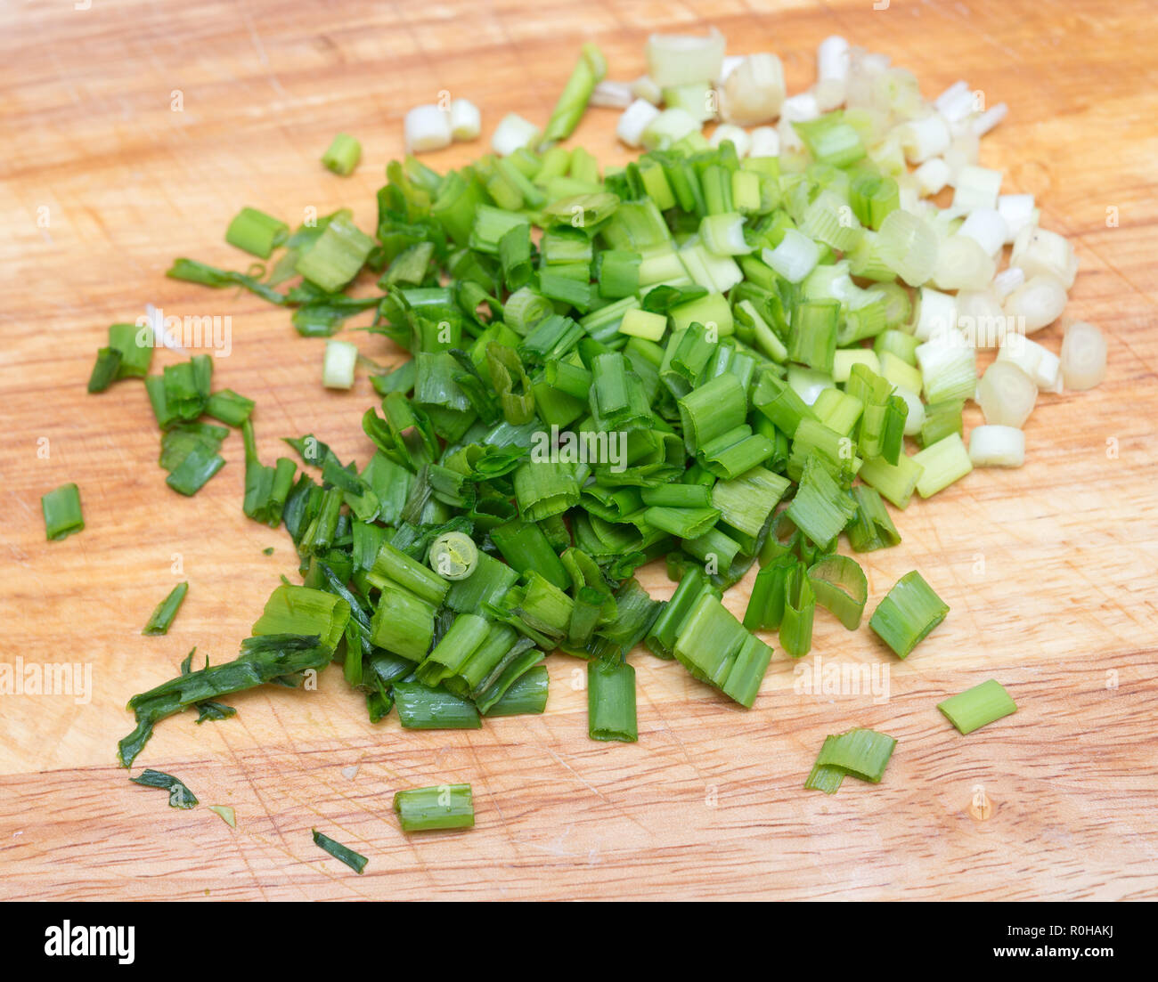 Handful Of Finely Chopped Green Onions On Striped Wooden Board Stock Photo,  Picture and Royalty Free Image. Image 40966933.