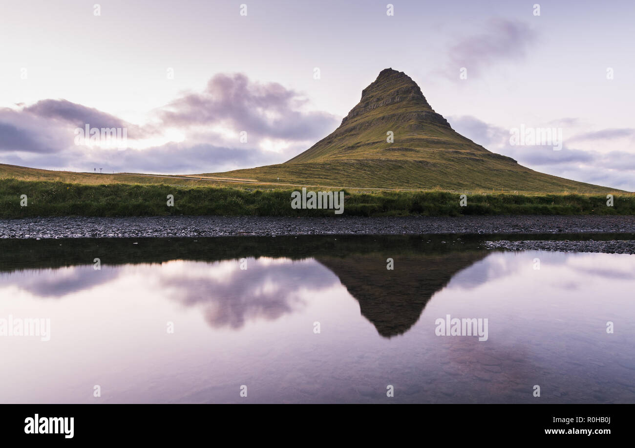 Reflection of Kirkjufell moutain in the water at sunset, Snaefellsnes peninsula, Iceland. Stock Photo