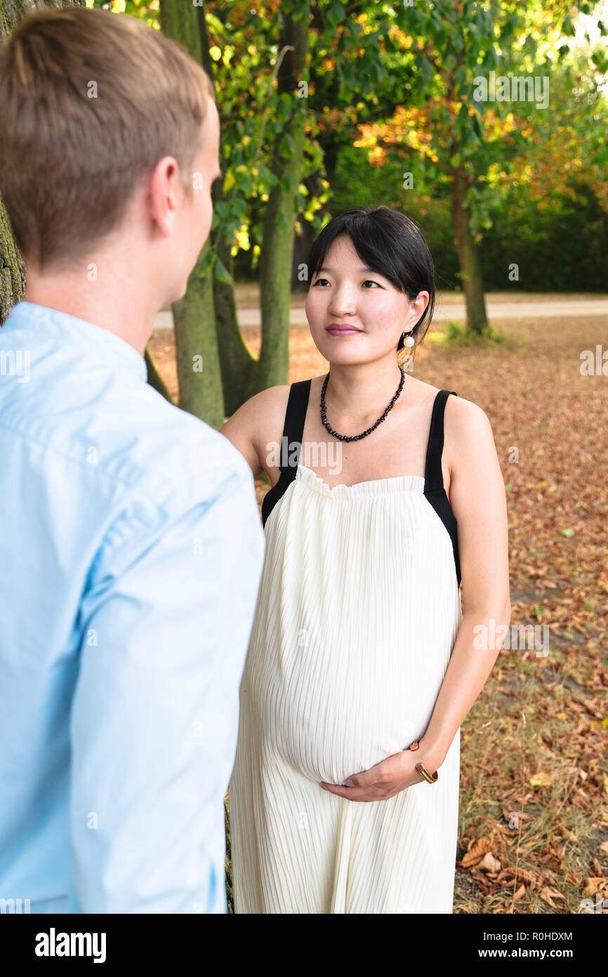 Pregnant girl in white shirt hi-res stock photography and images - Alamy