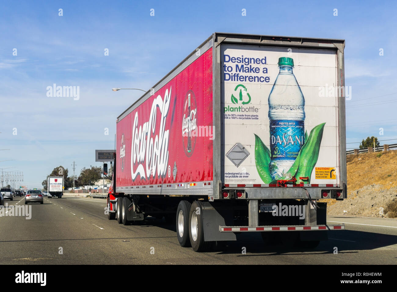 October 27, 2018 Fremont / CA / USA - Coca Cola truck driving on the freeway in East San Francisco Bay Area; Coca Cola logo printed on the side and Da Stock Photo