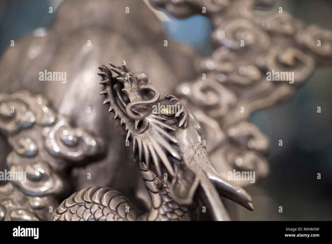 Bonhams, New Bond Street, London, UK. 5 November, 2018. The preview of Bonhams Fine Japanese, Fine Chinese and The Ollivier Collection of Early Chinese Art: A Journey Through Time sale is held  before Asian Art Week. Image: Detail from a large and unusual silver, shibuich and gilt Okimono of a Dragon Ascending mount Fuji, Meiji era, estimate £30,000-50,000. Credit: Malcolm Park/Alamy Live News. Stock Photo