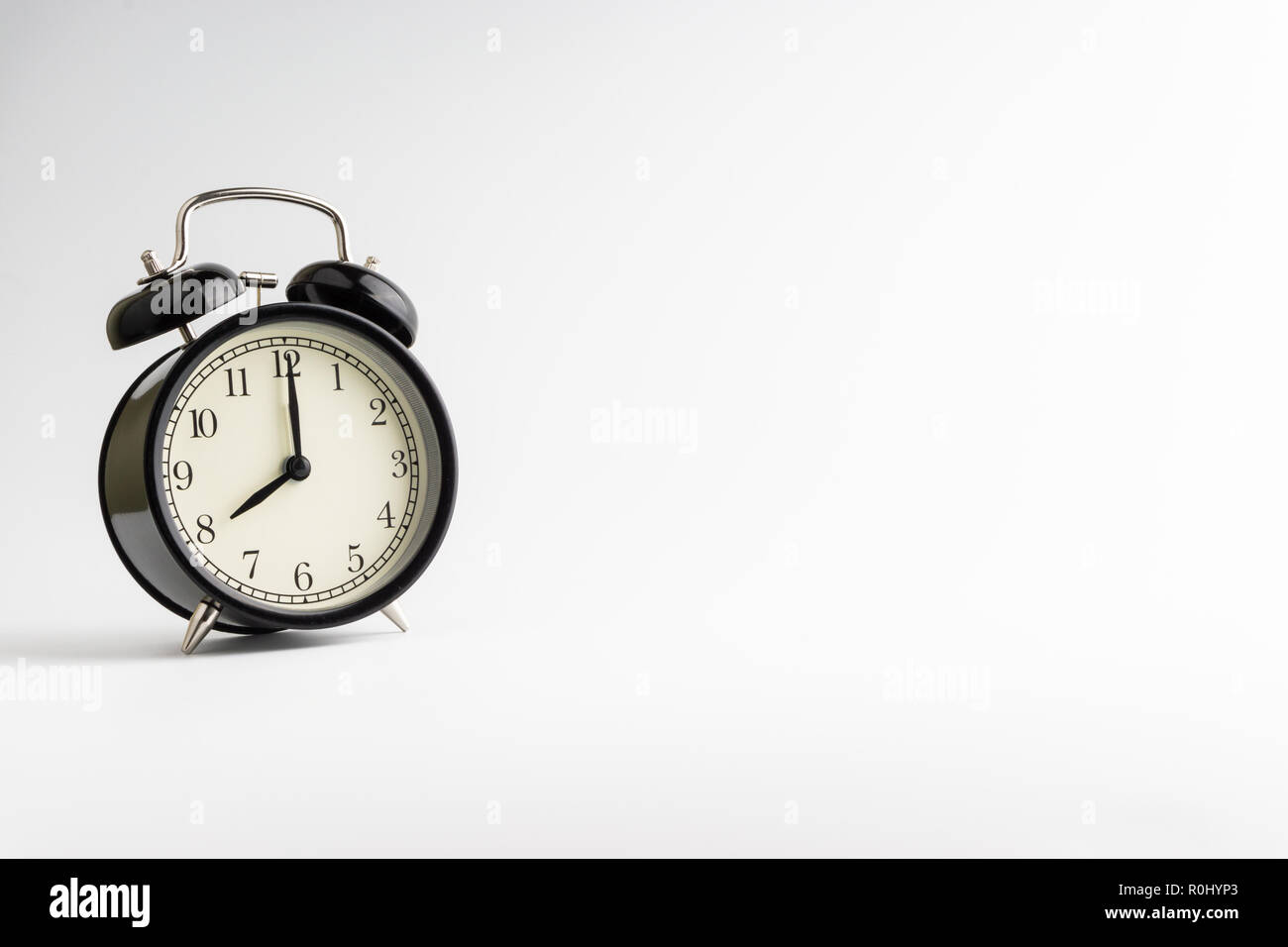 Alarm clock on white background with selective focus Stock Photo