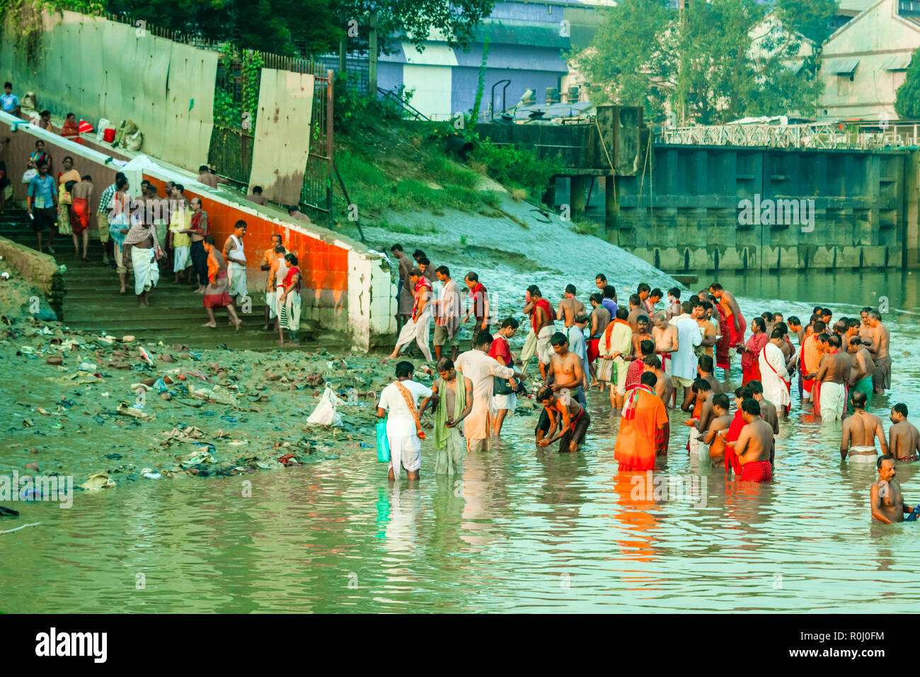 HARIDWAR, INDIA - JANUARY 14, 2016: Devotees taking holy dip at Har Ki Pauri on river Ganga on the first bath of Ardh Kumbh fair. People took a dip in Stock Photo