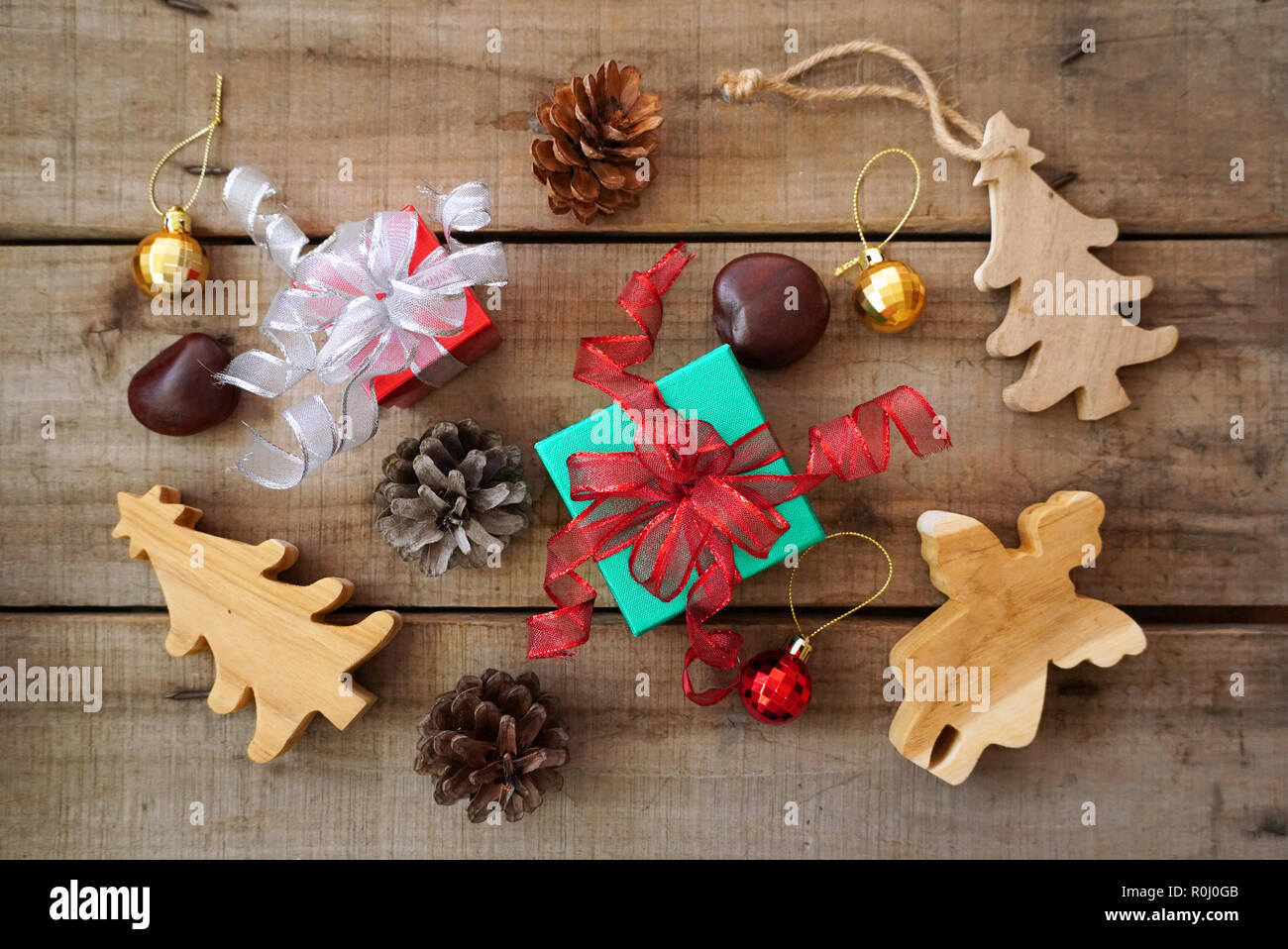 Topview green and red gift boxes with pinecone and christmas tree and ...