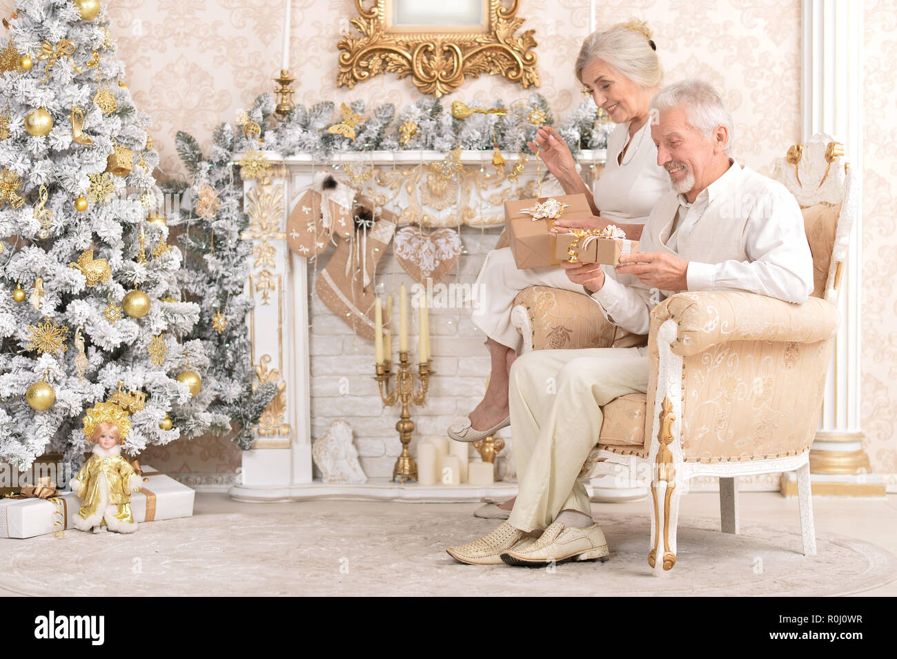 Portrait of happy senior couple celebrating Christmas Stock Photo