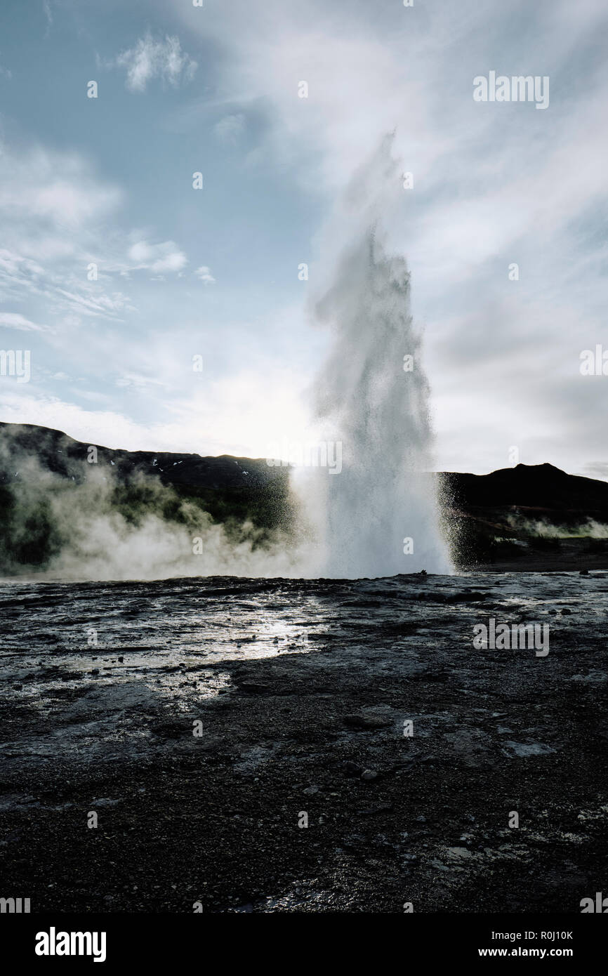 Strokkur in the popular tourist destination of Geysir hot spring in the geothermal area of Haukadalur Valley, found in south-west Iceland. Stock Photo