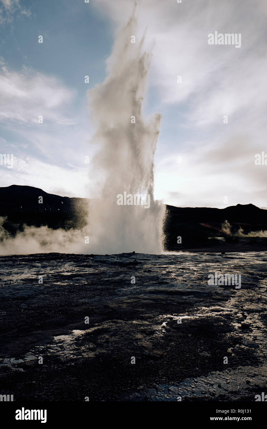 Strokkur in the popular tourist destination of Geysir hot spring in the geothermal area of Haukadalur Valley, found in south-west Iceland. Stock Photo