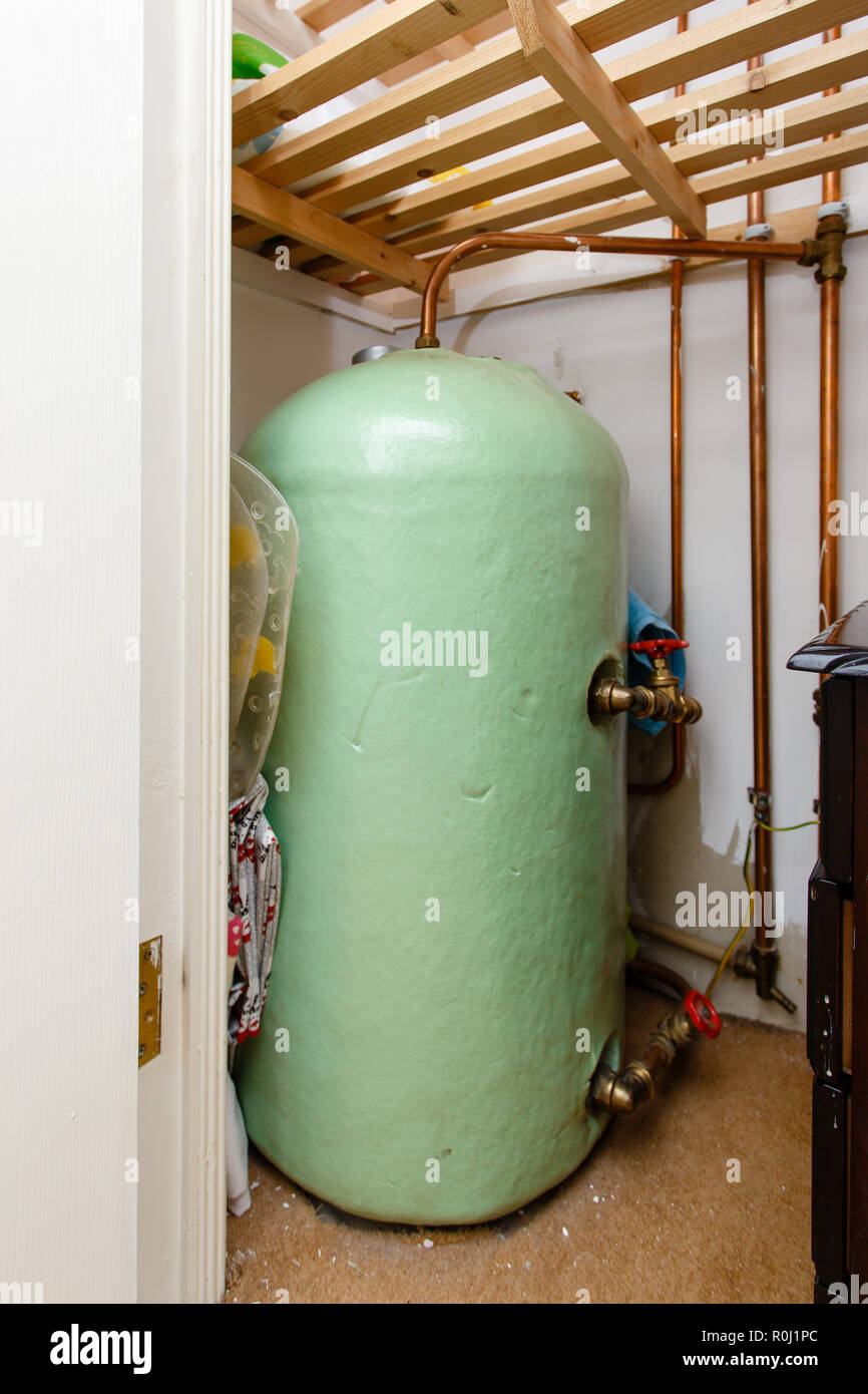 Standard insulated hot water cylinder found in most Irish homes located  in the hot press or airing cupboards. Stock Photo