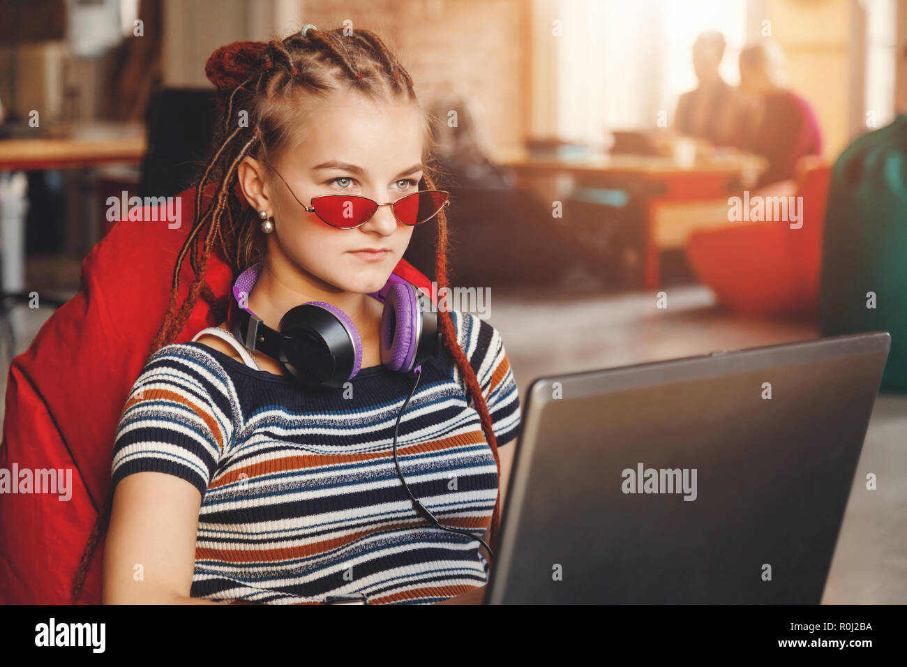 Hipster Cute Student Girl With Dreads Wearing Glasses And