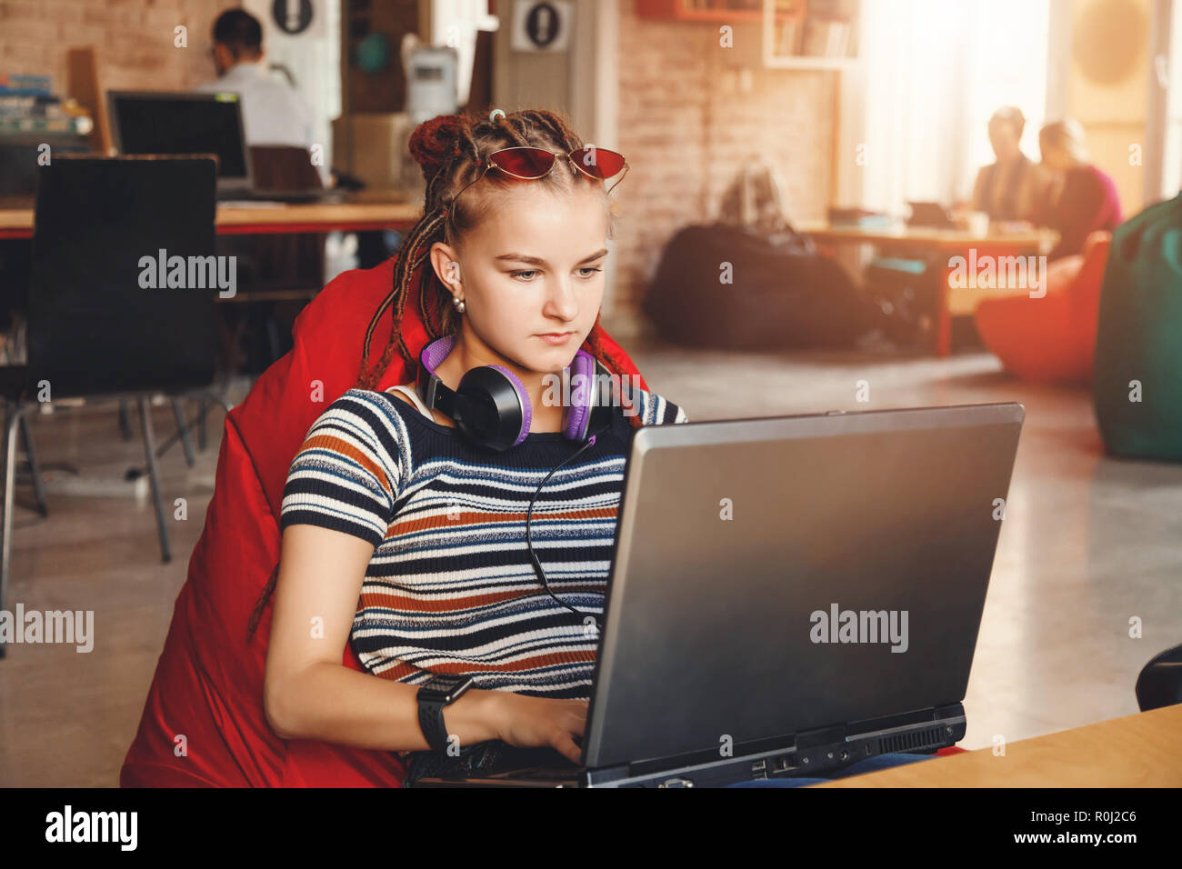 Hipster Cute Student Girl With Dreads Wearing Headphones
