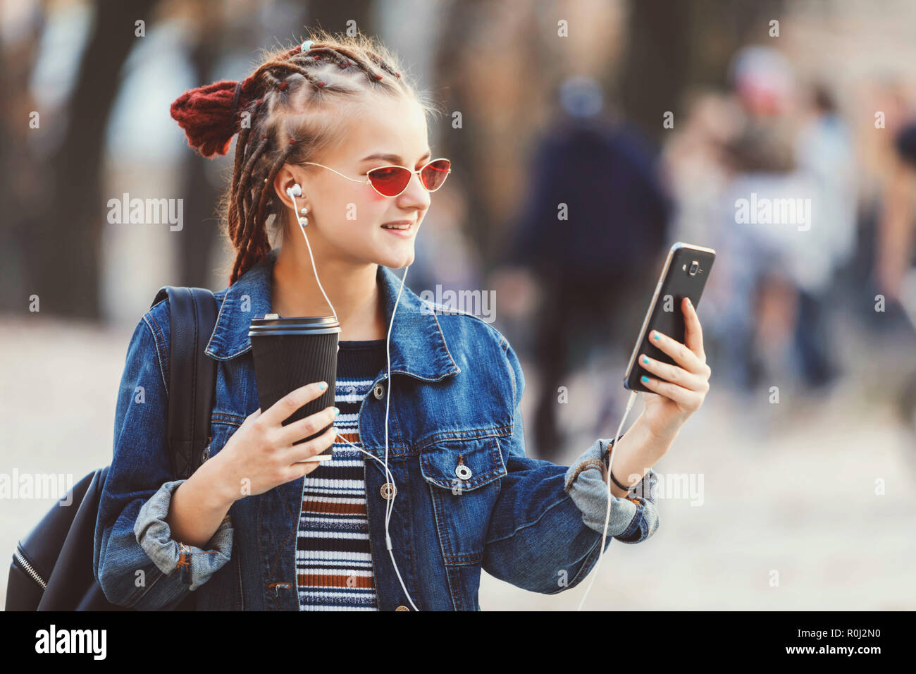 Portrait Of Hipster Cute Girl With Dreads Wearing Headphones