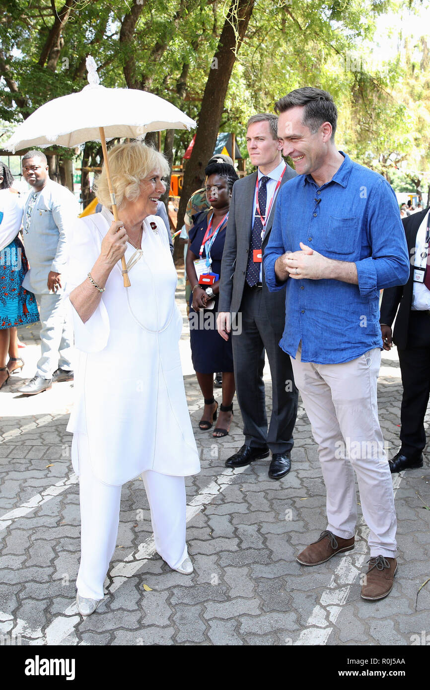 The Duchess of Cornwall chats with CNN Correspondent Max Foster at a Commonwealth Big Lunch at the Ghana International School (G.I.S.) Junior Site, in Accra, Ghana, on day six of her trip to west Africa with the Prince of Wales. Stock Photo