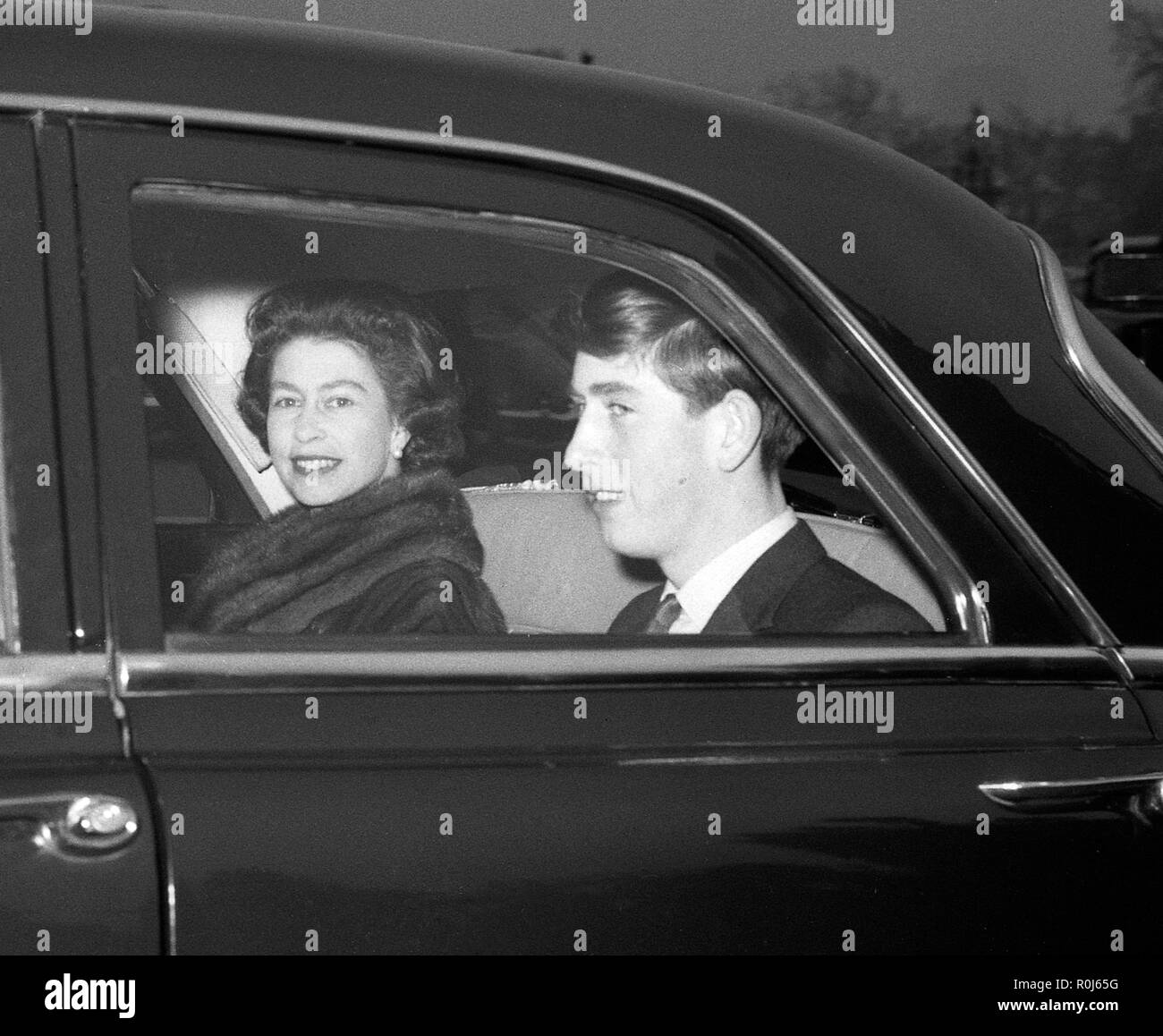 Queen Elizabeth II and her son, Prince Charles, in a chaffer-driven car as they left Buckingham Palace for Windsor Castle, where they are to spend the Christmas holidays with other members of the Royal Family. Stock Photo