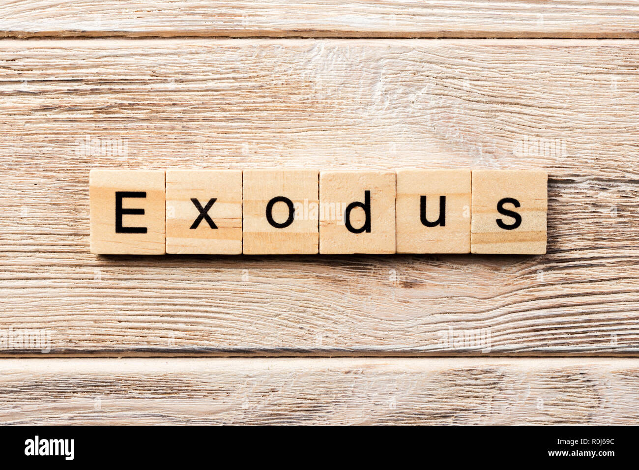 exodus word written on wood block. exodus text on table, concept Stock