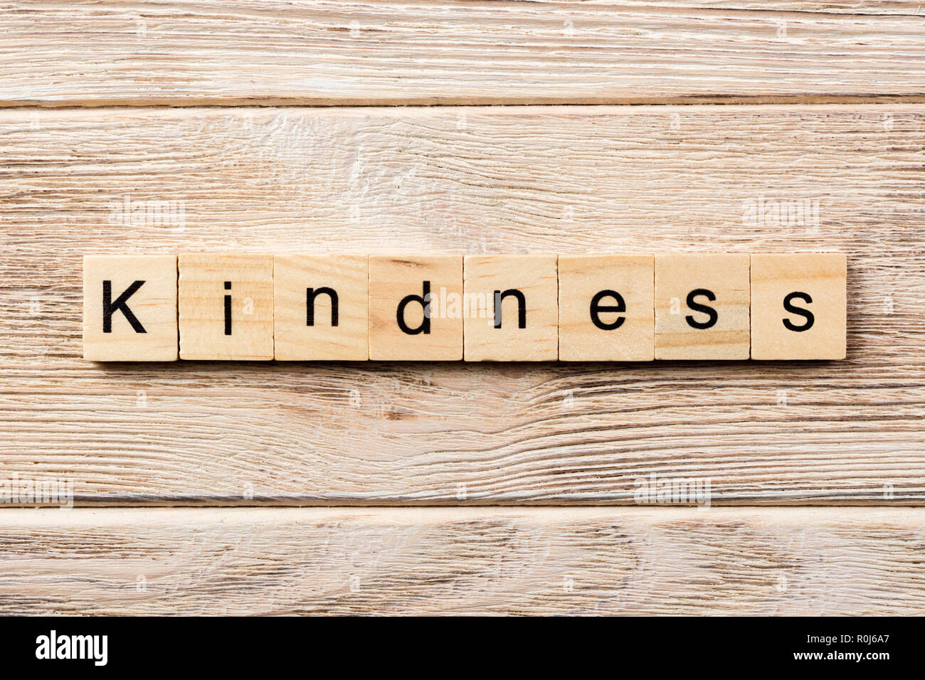 kindness word written on wood block. kindness text on table, concept. Stock Photo