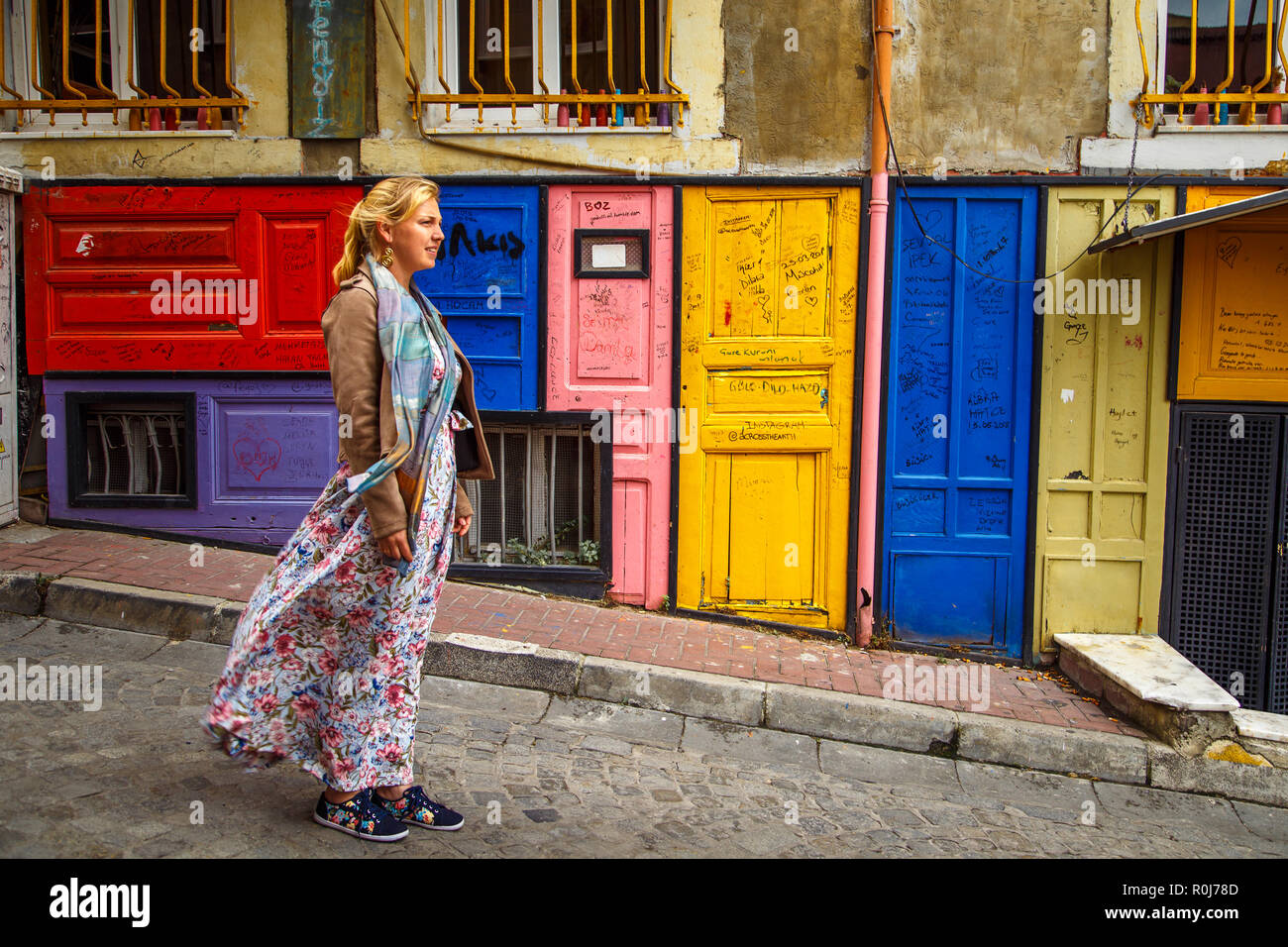 The girl in Istanbul. Colorful houses Balat district. Stock Photo
