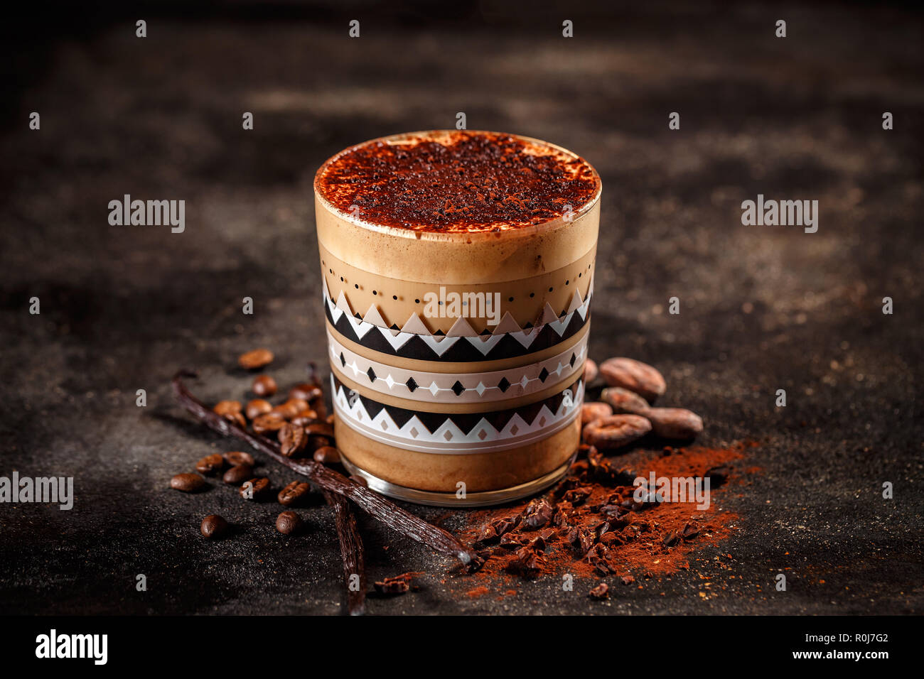 Winter Coffee Drink In Glass Spiced With Cocoa Powder And Vanilla Stock winter-coffee-drink-in-glass-spiced-with-cocoa-powder-and-vanilla-stock