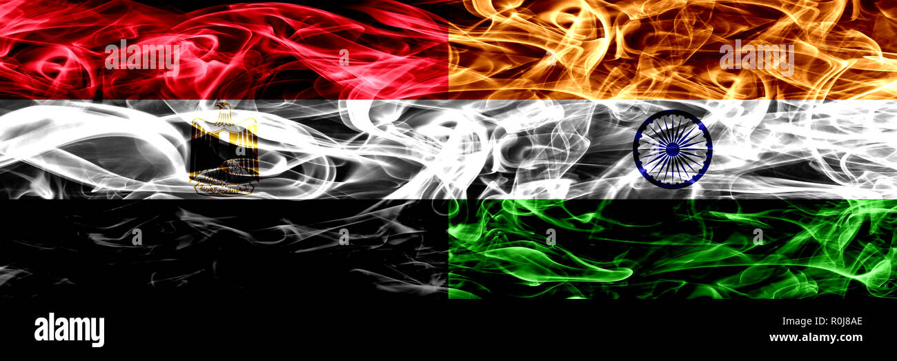 Egypt, Egyptian vs India, Indian smoke flags placed side by side. Thick abstract colored silky smoke flags Stock Photo