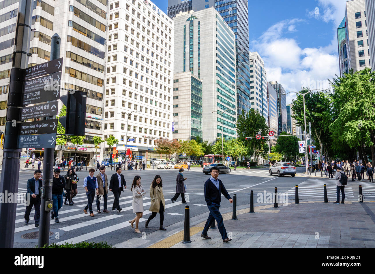 Tall buildings against a blue sky with clouds in this cityscape vew of the Gangnam district of Seoul in South Korea. Stock Photo