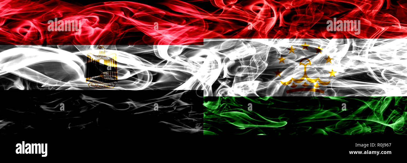 Egypt, Egyptian vs Tajikistan, Tajikistani smoke flags placed side by side. Thick abstract colored silky smoke flags Stock Photo