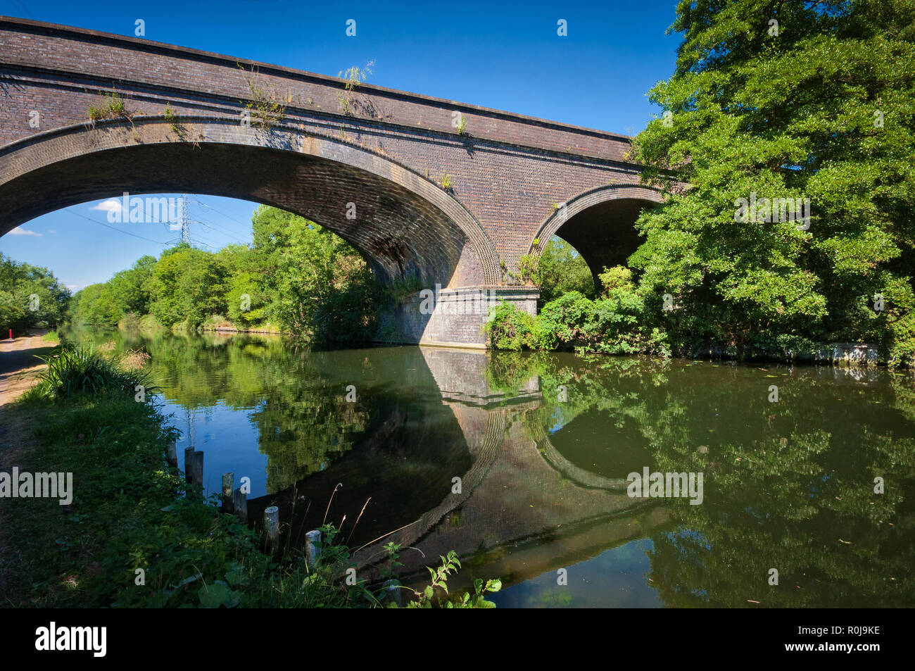 A train bridge near Denham above the Grand Union Canal, United Kingdom Stock Photo