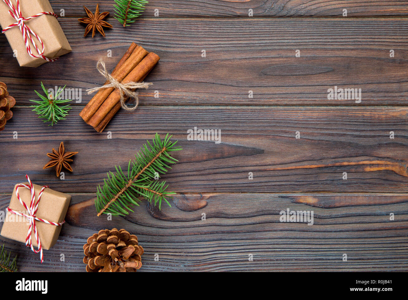 Christmas background with fir tree and gift box on wooden table. Top ...