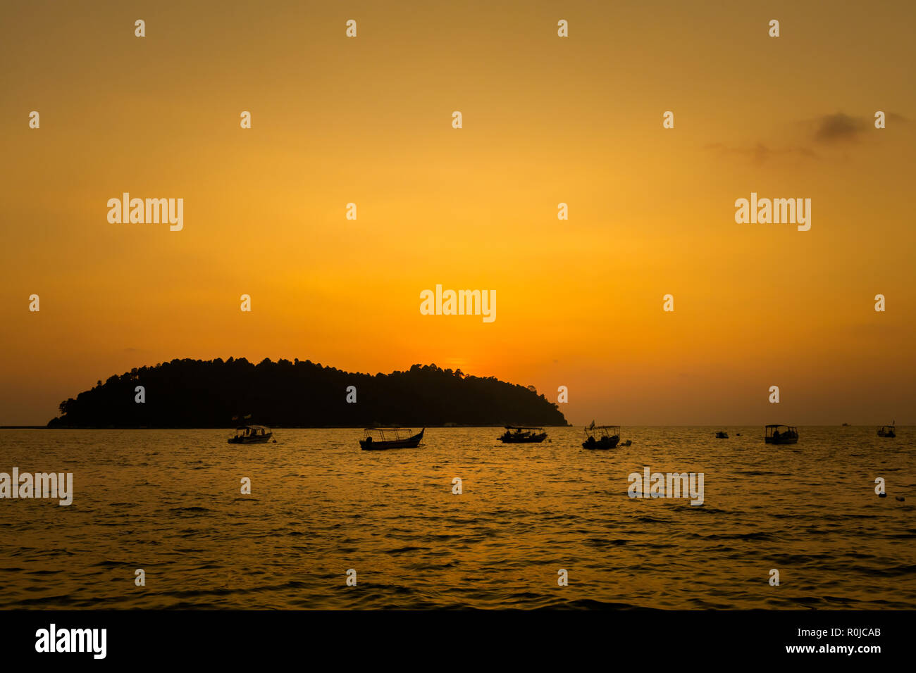 Teluk Nipah coral beach on Pangkor island in Malaysia. Beautiful landscape with sea  taken during golden sunset in south east Asia. Stock Photo