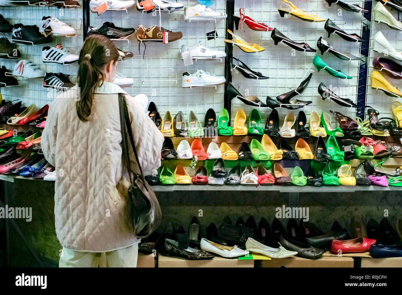 A young woman buying shoes in the indoor market in Krakow Poland Stock  Photo - Alamy