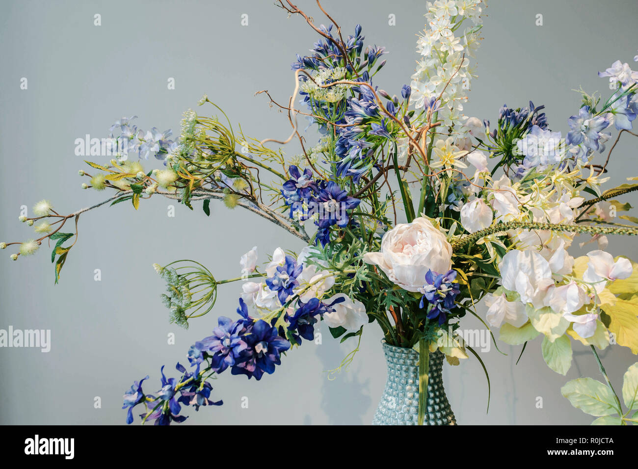 Colorful Fake Flowers In A Vase On The Table Colorful Green And Blue Background Texture Modern Design Stock Photo Alamy