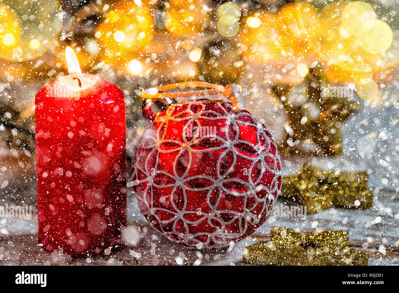 Golden christmas tree ball with fir branch, stars and snow Stock Photo