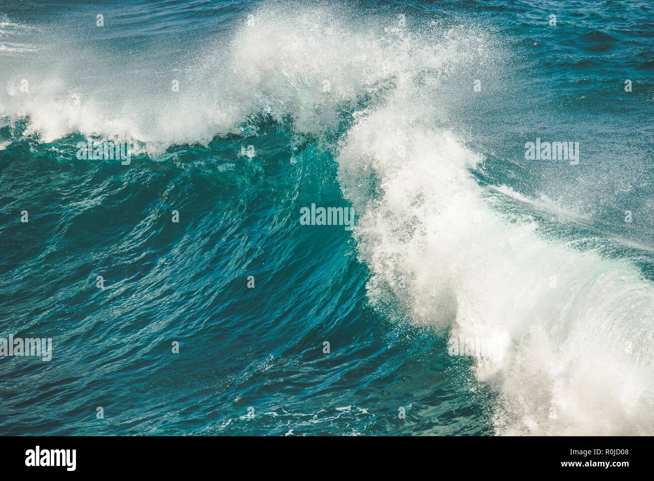 Close-up water clear turquoise splashing ocean wave. Bali. Perfect