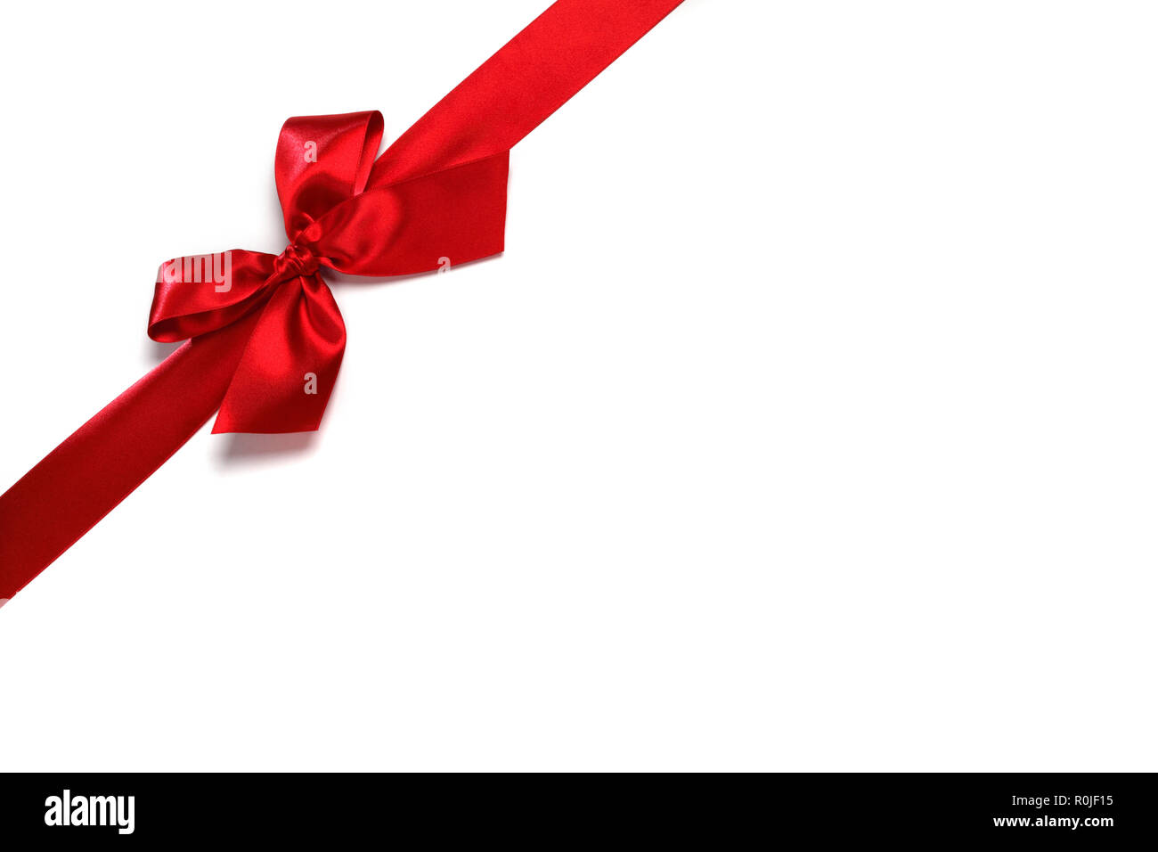 Decorative red satin bow isolated on white background Stock Photo - Alamy