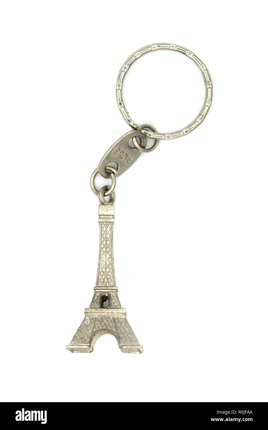 Miniature Eiffel Tower metallic key-chain Paris souvenir cut out isolated on white background Stock Photo